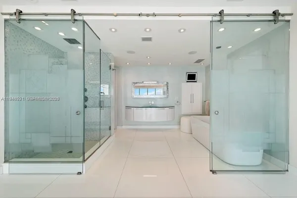 a spacious bathroom with a shower and a bathtub