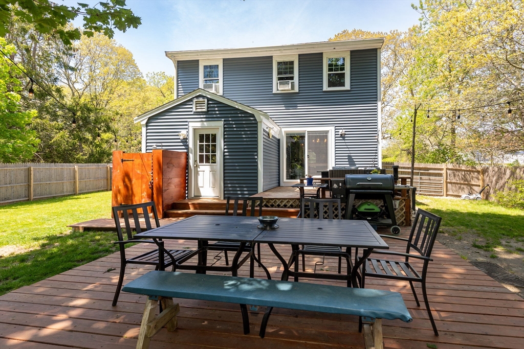1020 Old Falmouth Road Barnstable, MA 02632 - Photo 9 of 42 a view of a dinning table and chairs in the patio