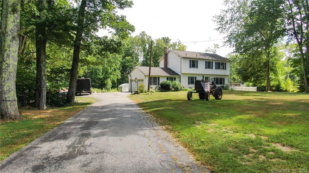 98 Windham Road Brooklyn, CT 06234 - Photo 1 of 1 a view of a park with large trees and a pathway