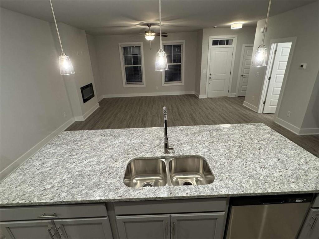 2530 Harbor Ridge Gainesville, GA 30507 - Photo 11 of 44 a kitchen with kitchen island granite countertop a sink and refrigerator
