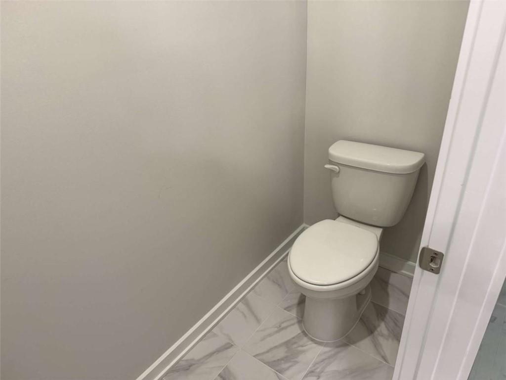 2530 Harbor Ridge Gainesville, GA 30507 - Photo 34 of 44 a white toilet sitting next to a white cabinet