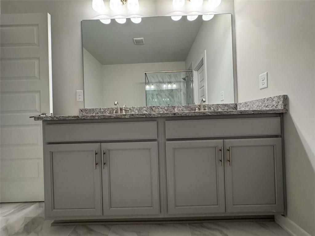 2530 Harbor Ridge Gainesville, GA 30507 - Photo 35 of 44 a bathroom with a sink and vanity