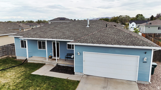 1437 925 South Vernal, UT 84078 - Photo 39 of 47 Ranch-style residence featuring light blue siding, an attached two-car garage, and a covered front entry