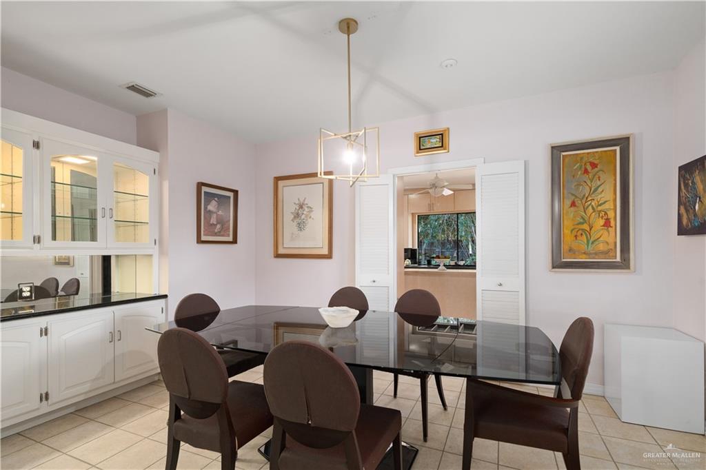 1113 Xanthisma Avenue McAllen, TX 78504 - Photo 10 of 30 Dining room featuring a chandelier and light tile patterned floors