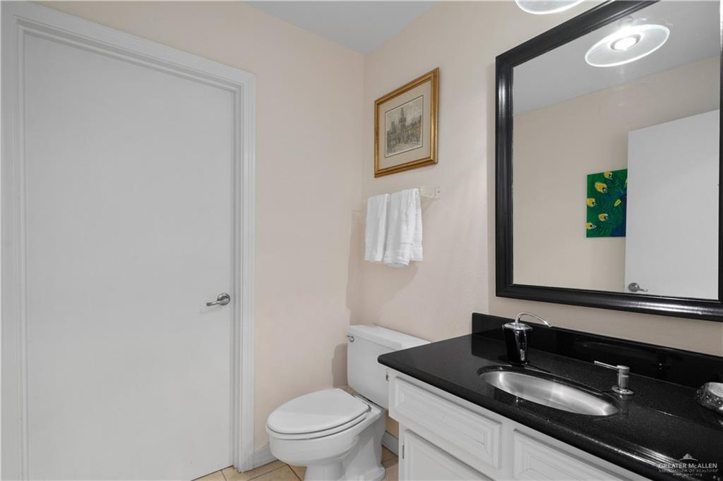 1113 Xanthisma Avenue McAllen, TX 78504 - Photo 20 of 30 Half bathroom featuring vanity and light tile patterned flooring