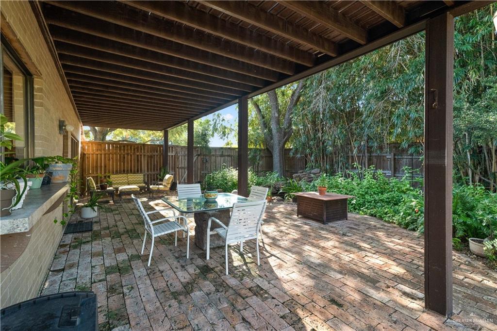 1113 Xanthisma Avenue McAllen, TX 78504 - Photo 21 of 30 Fenced backyard with a patio area and outdoor dining area