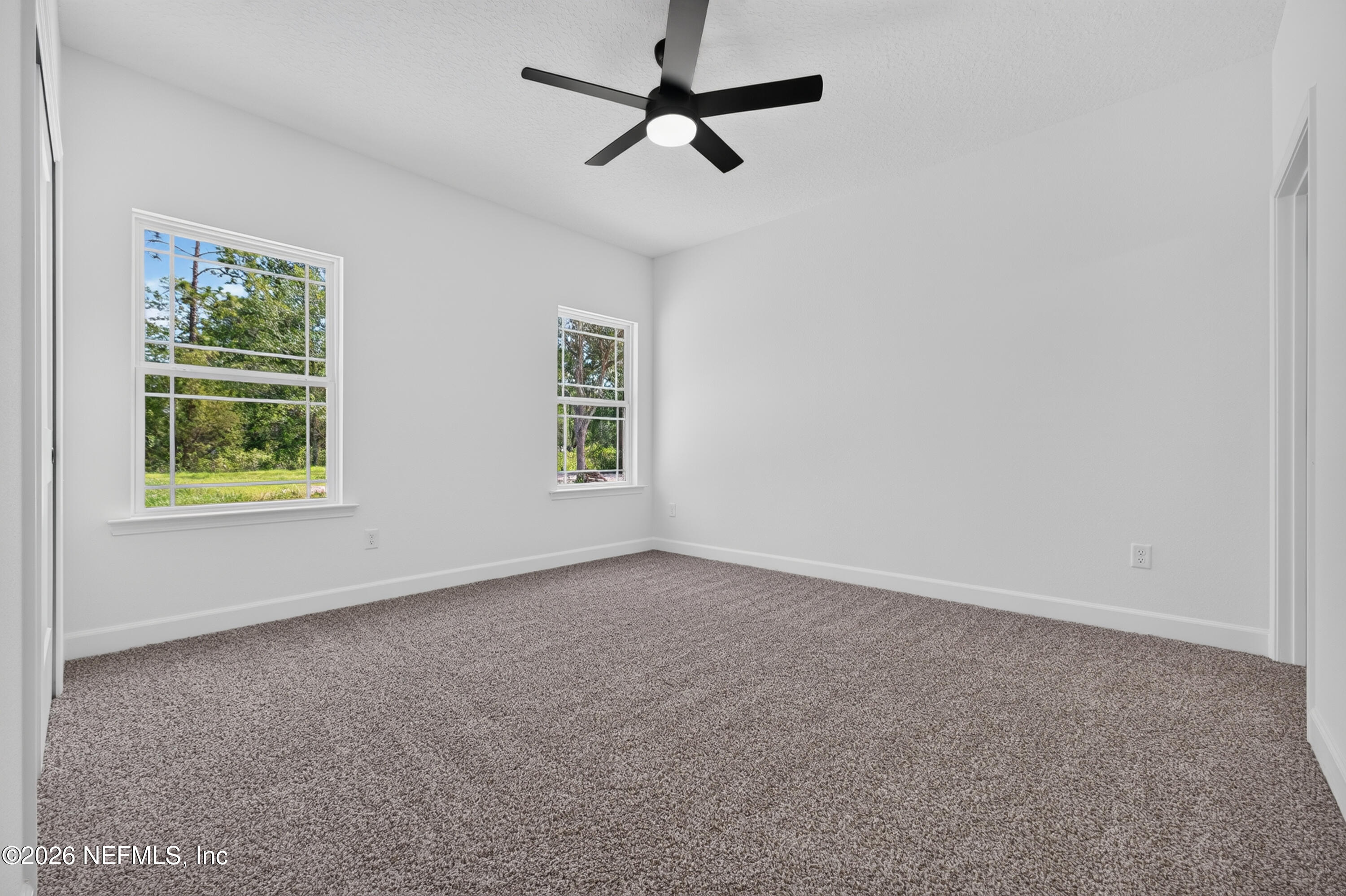 4362 Angora Street Middleburg, FL 32068 - Photo 14 of 31 an empty room with windows and fan