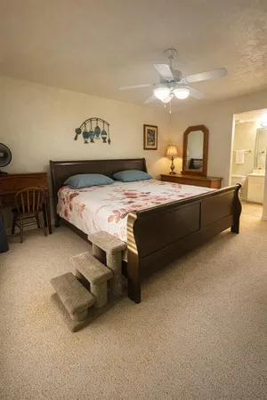 a bedroom with a bed and a table