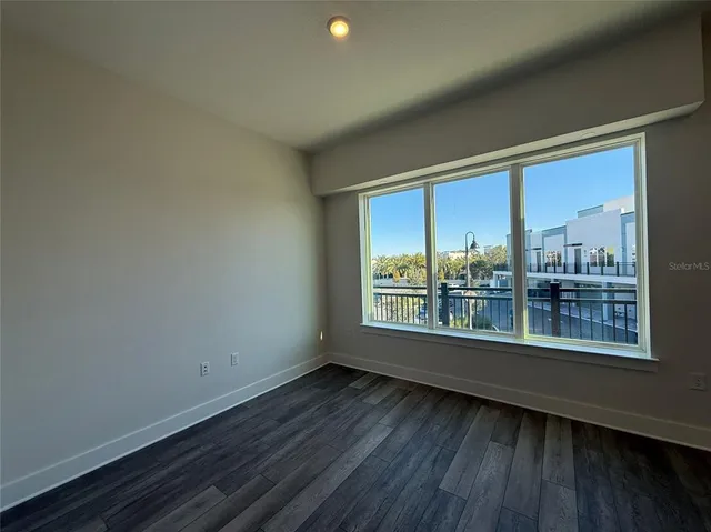 a view of a room that has a large window