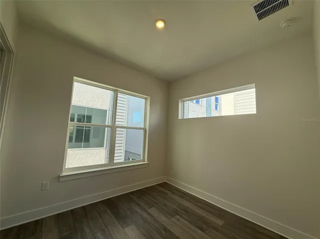 an empty room with windows