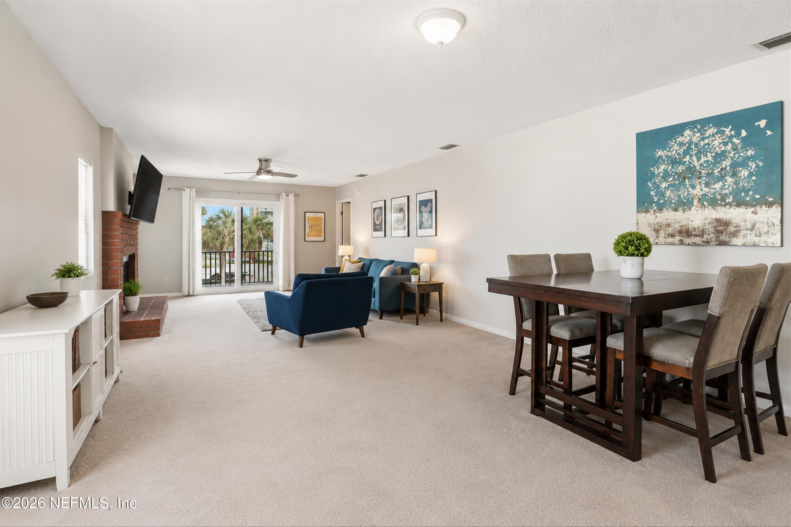 124 Hopkins Street Neptune Beach, FL 32266 - Photo 8 of 44 a view of a dining room with furniture and a potted plant