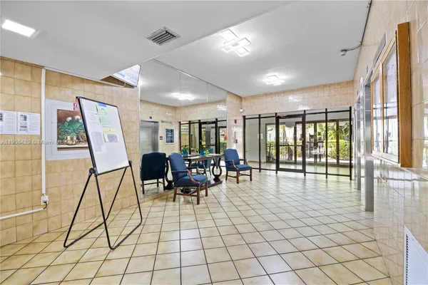 a living room with furniture and white walls