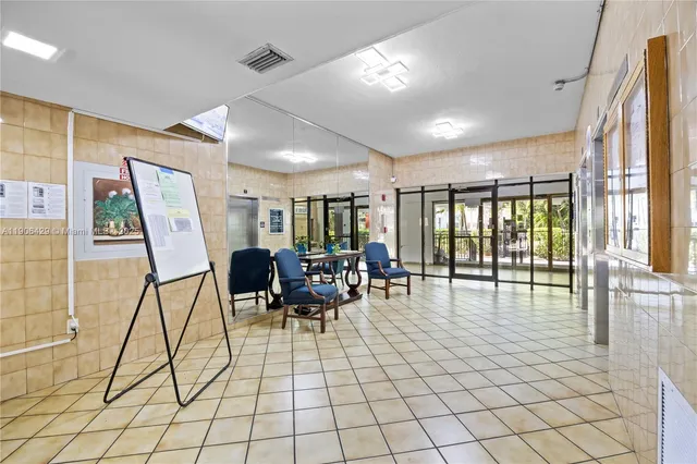 a living room with furniture and white walls