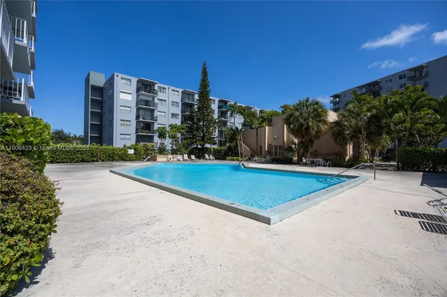 a view of outdoor space with swimming pool and patio