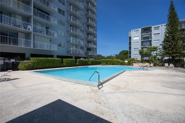 a view of a building with a yard