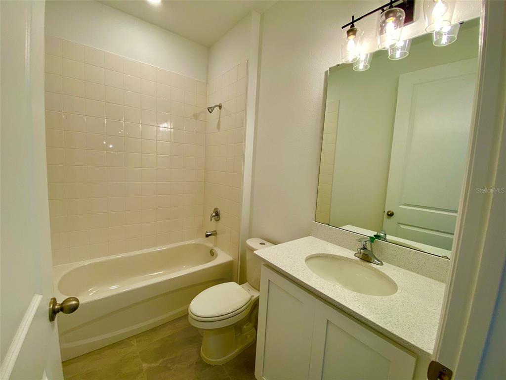 2190 Derwent Drive Davenport, FL 33896 - Photo 11 of 30 a bathroom with a sink a toilet and shower