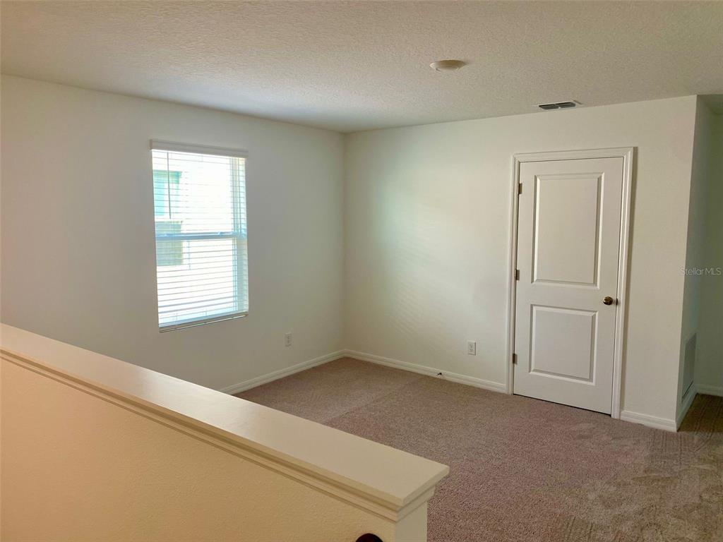 2190 Derwent Drive Davenport, FL 33896 - Photo 12 of 30 a view of an empty room with a window