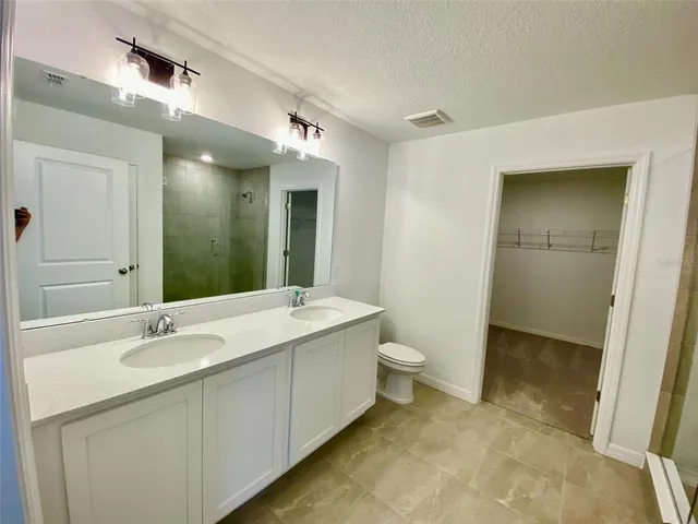 a view of a bathroom with a glass shower door