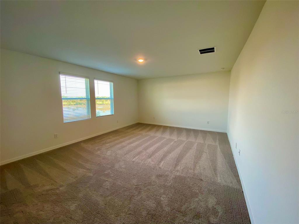 2190 Derwent Drive Davenport, FL 33896 - Photo 16 of 30 an empty room with windows
