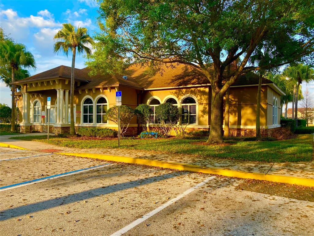 2190 Derwent Drive Davenport, FL 33896 - Photo 28 of 30 a front view of a house with a yard table and chairs