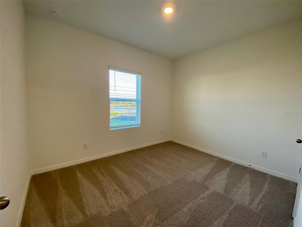 2190 Derwent Drive Davenport, FL 33896 - Photo 8 of 30 an empty room with a window