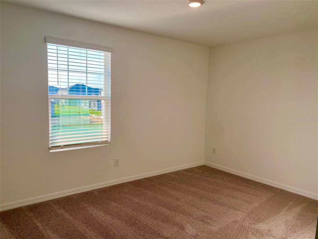 2190 Derwent Drive Davenport, FL 33896 - Photo 10 of 30 an empty room with a window
