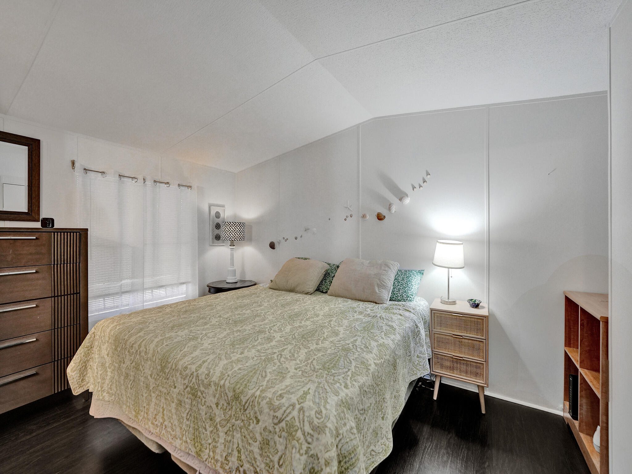 14609 Sunset Drive Delray Beach, FL 33445 - Photo 17 of 50 a bedroom with a bed and lamp