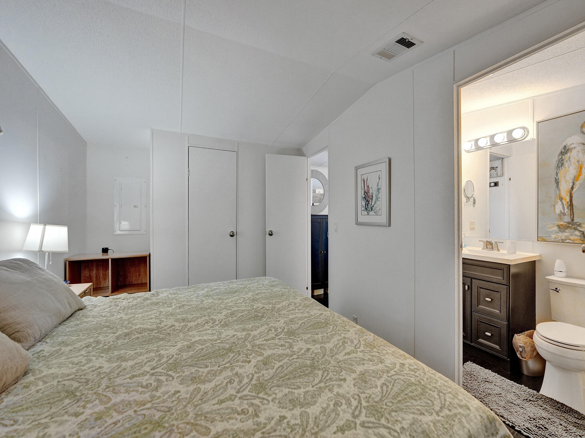 14609 Sunset Drive Delray Beach, FL 33445 - Photo 19 of 50 a bedroom with a bed and a dresser