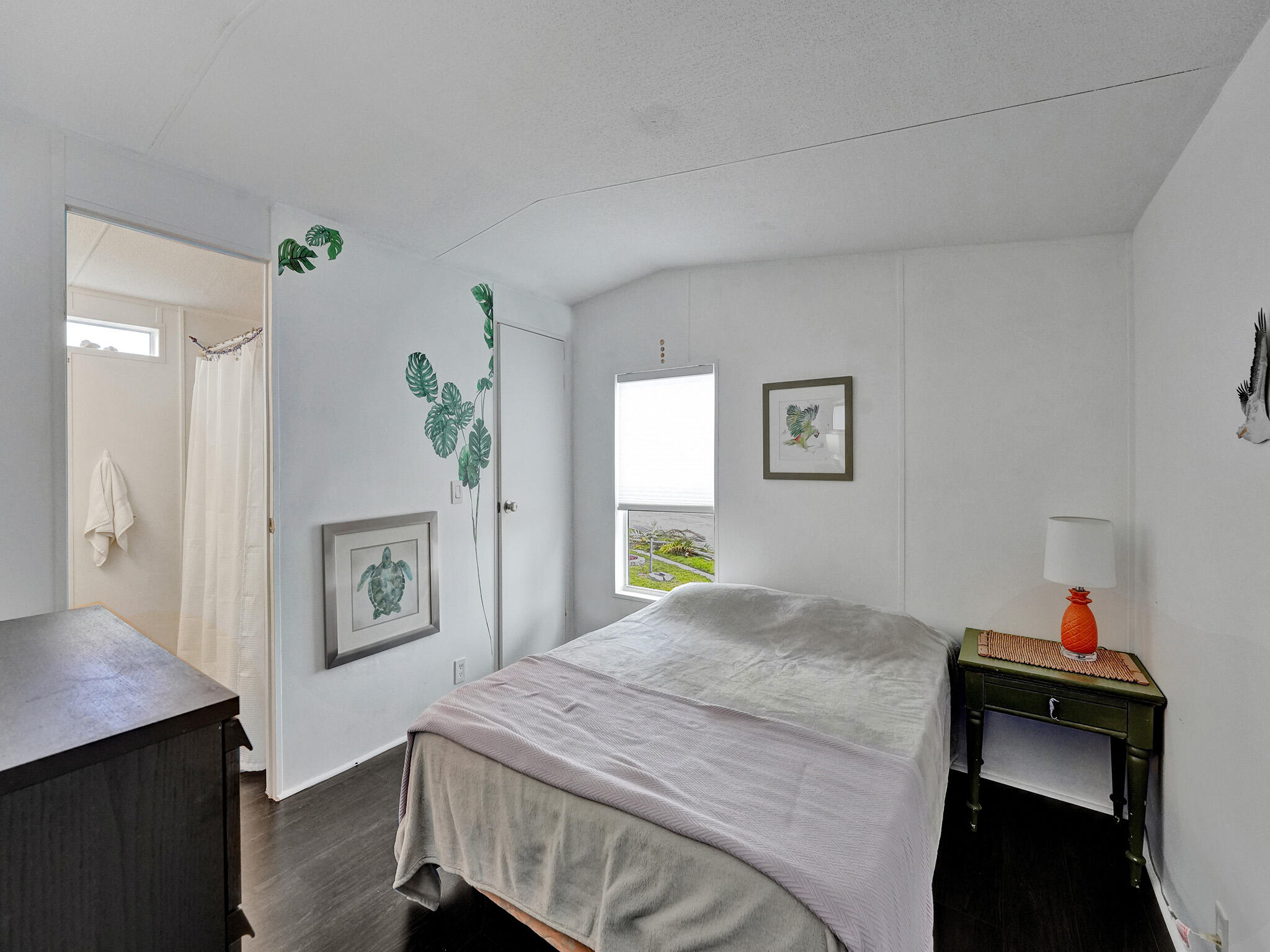 14609 Sunset Drive Delray Beach, FL 33445 - Photo 26 of 50 a bedroom with a bed and a table