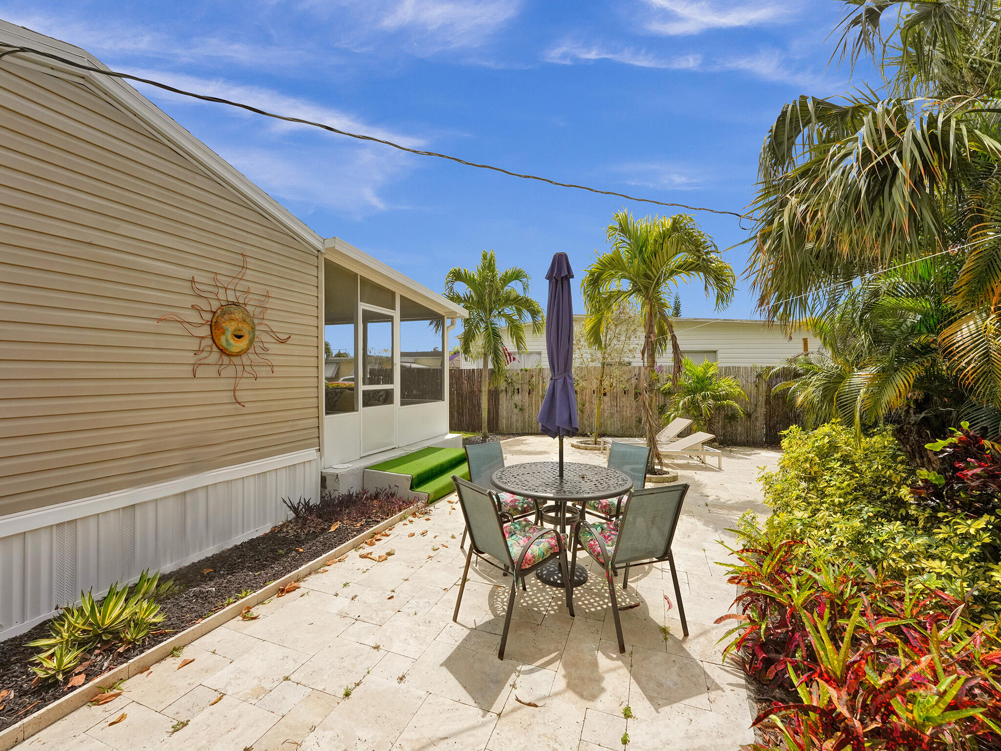 14609 Sunset Drive Delray Beach, FL 33445 - Photo 8 of 50 a view of a chairs and table in the patio