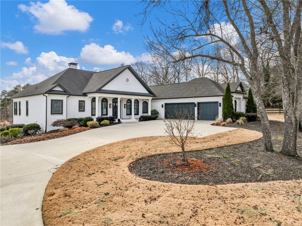 5651 Old Wilkie Road Gainesville, GA 30506 - Photo 11 of 78 a front view of a house with a yard