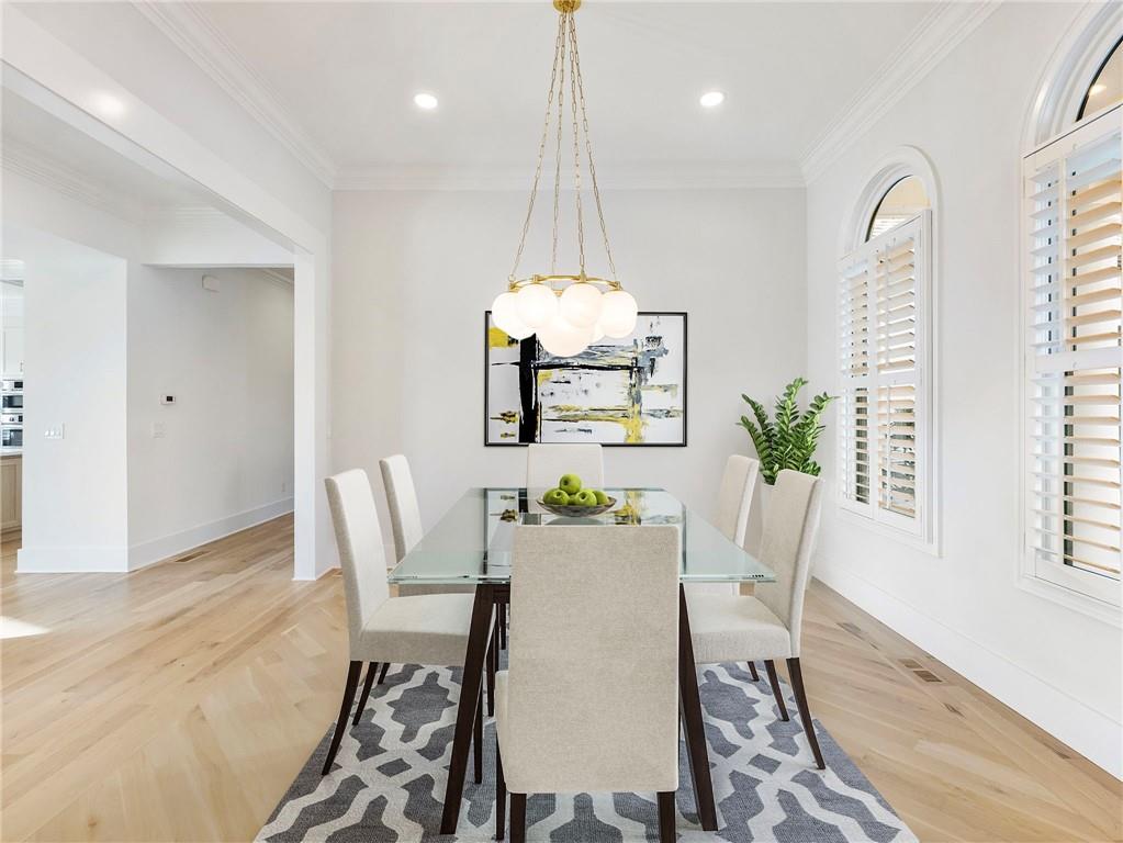 5651 Old Wilkie Road Gainesville, GA 30506 - Photo 13 of 78 a dining room with furniture a chandelier and wooden floor