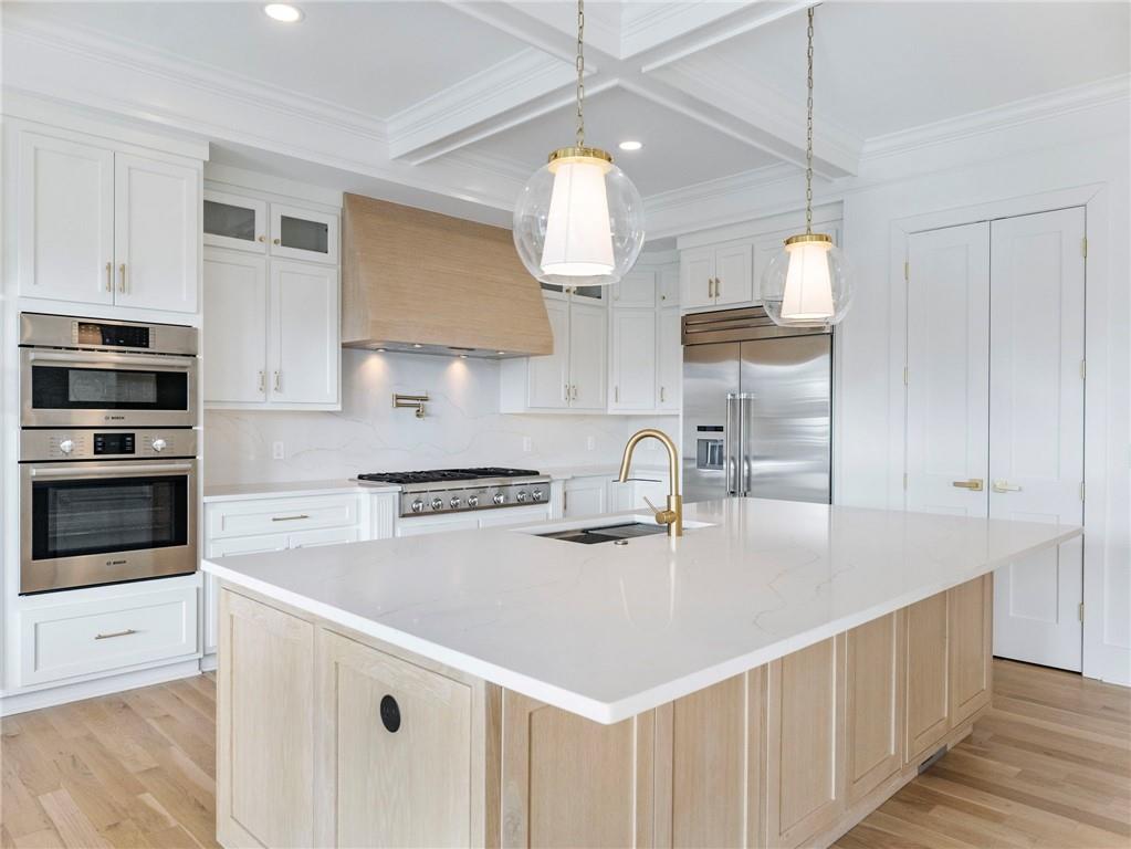5651 Old Wilkie Road Gainesville, GA 30506 - Photo 15 of 78 a kitchen with stainless steel appliances a sink a stove and a center island