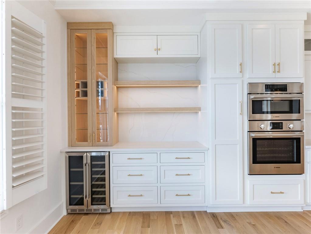 5651 Old Wilkie Road Gainesville, GA 30506 - Photo 17 of 78 a kitchen with granite countertop white cabinets and stainless steel appliances