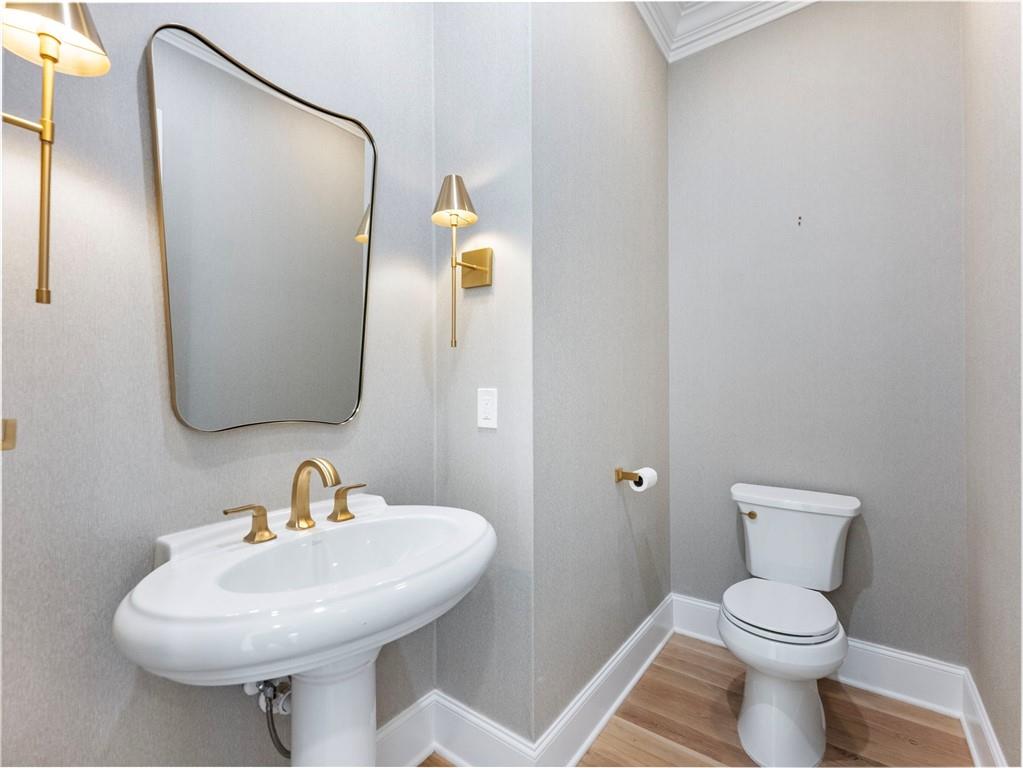 5651 Old Wilkie Road Gainesville, GA 30506 - Photo 23 of 78 a bathroom with a toilet sink and mirror
