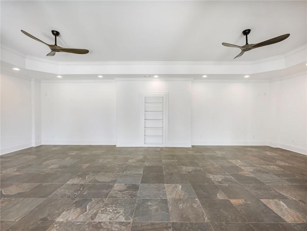5651 Old Wilkie Road Gainesville, GA 30506 - Photo 56 of 78 a view of a livingroom with a ceiling fan and a rug