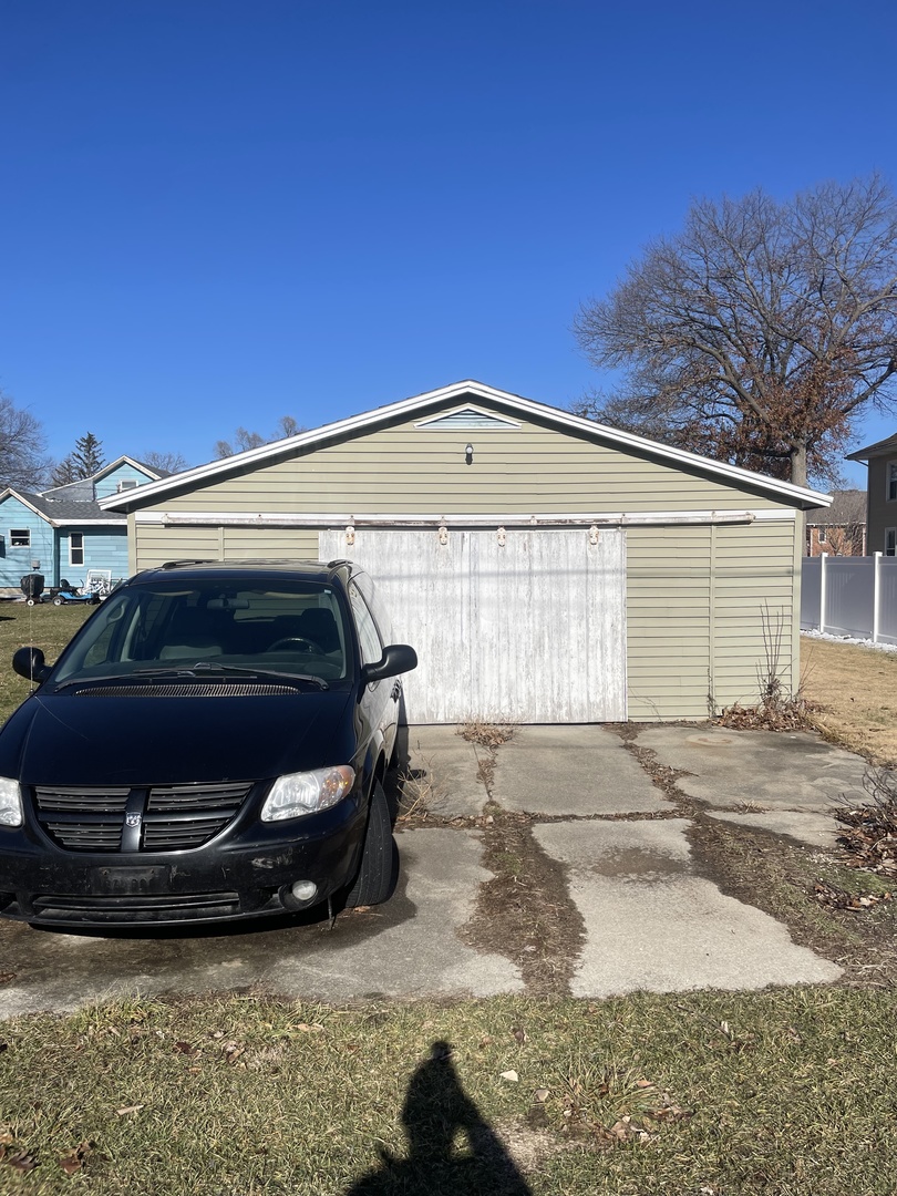 407 East Cherry Street Chatsworth, IL 60921 - Photo 2 of 2 a car parked in front of a house