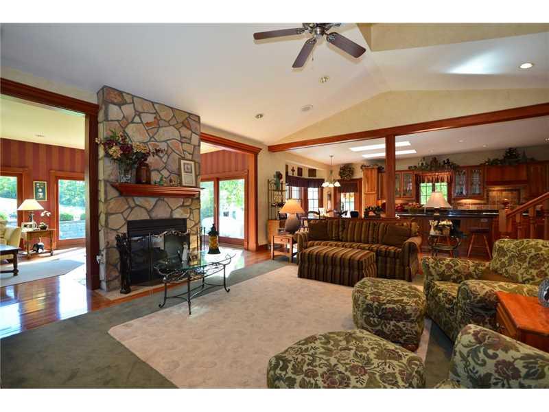 515 Seabright Road McDonald, PA 15057 - Photo 11 of 25 Family Room. TWO SIDED FIREPLACE ENHANCES BOTH FAMILY CENTER AND GLASSED ALL SEASON SUNROOM