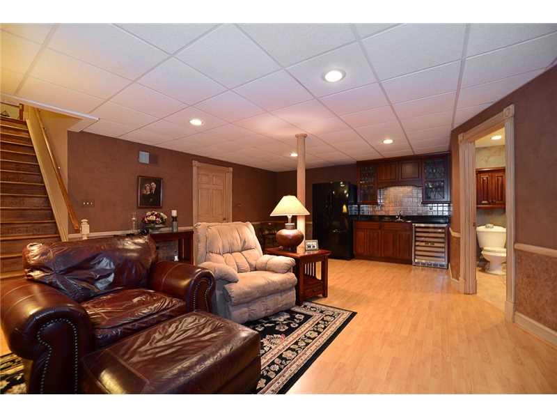 515 Seabright Road McDonald, PA 15057 - Photo 20 of 25 Great Room. ANOTHER VIEW OF LOWER LEVEL FEATURING WET, WINE REFRIGERATOR AND SECONDARY REFRIGERATOR.