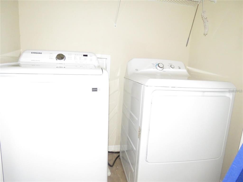 5868 Fishhawk Ridge Drive Lithia, FL 33547 - Photo 11 of 12 a utility room with dryer and washer