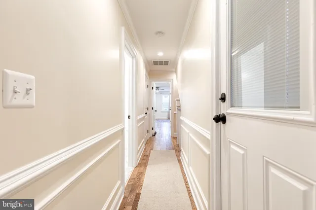a bathroom with a sink and a view of bathroom