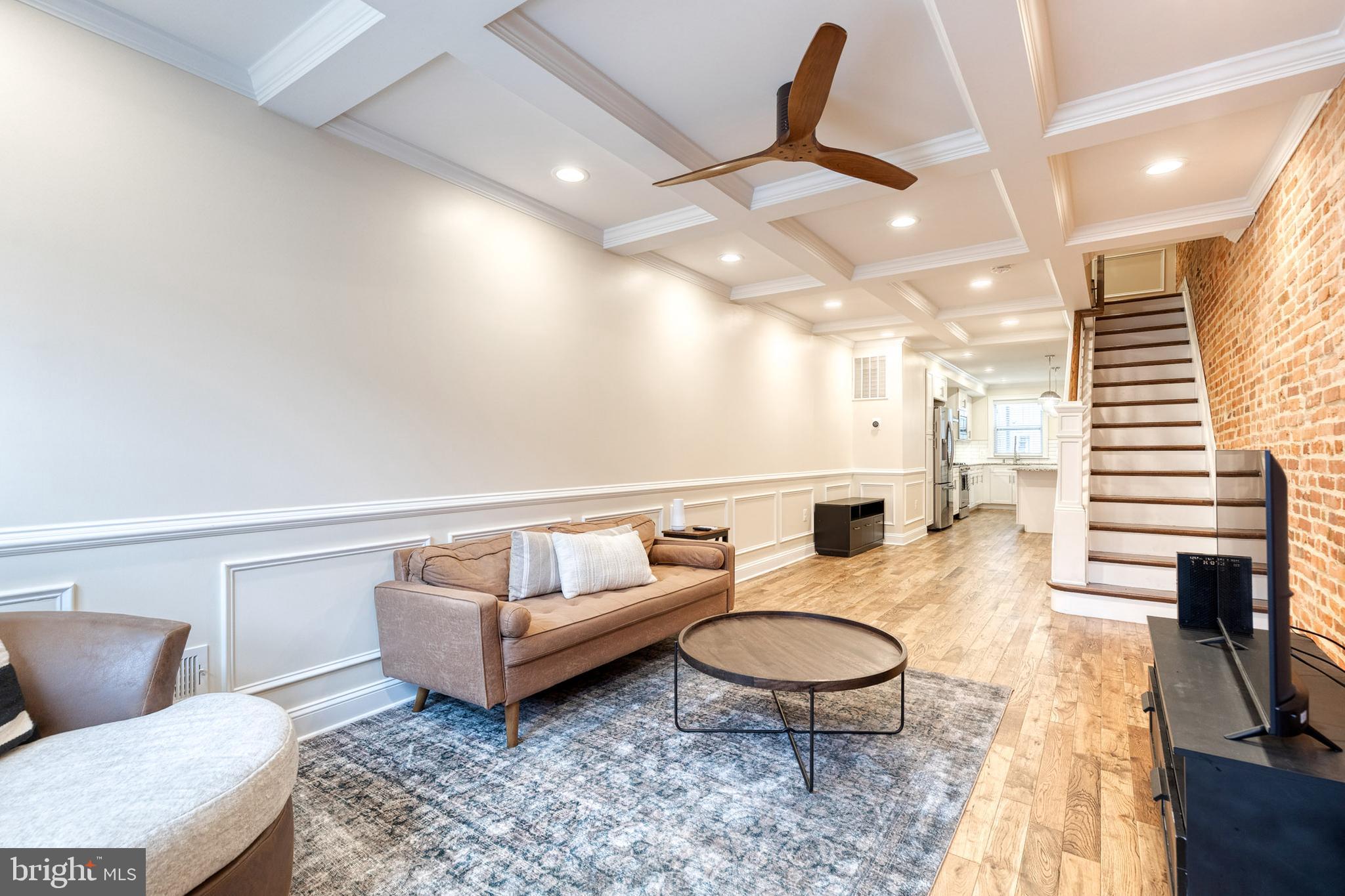635 South Curley Street Baltimore, MD 21224 - Photo 2 of 20 a living room with furniture a rug and white walls