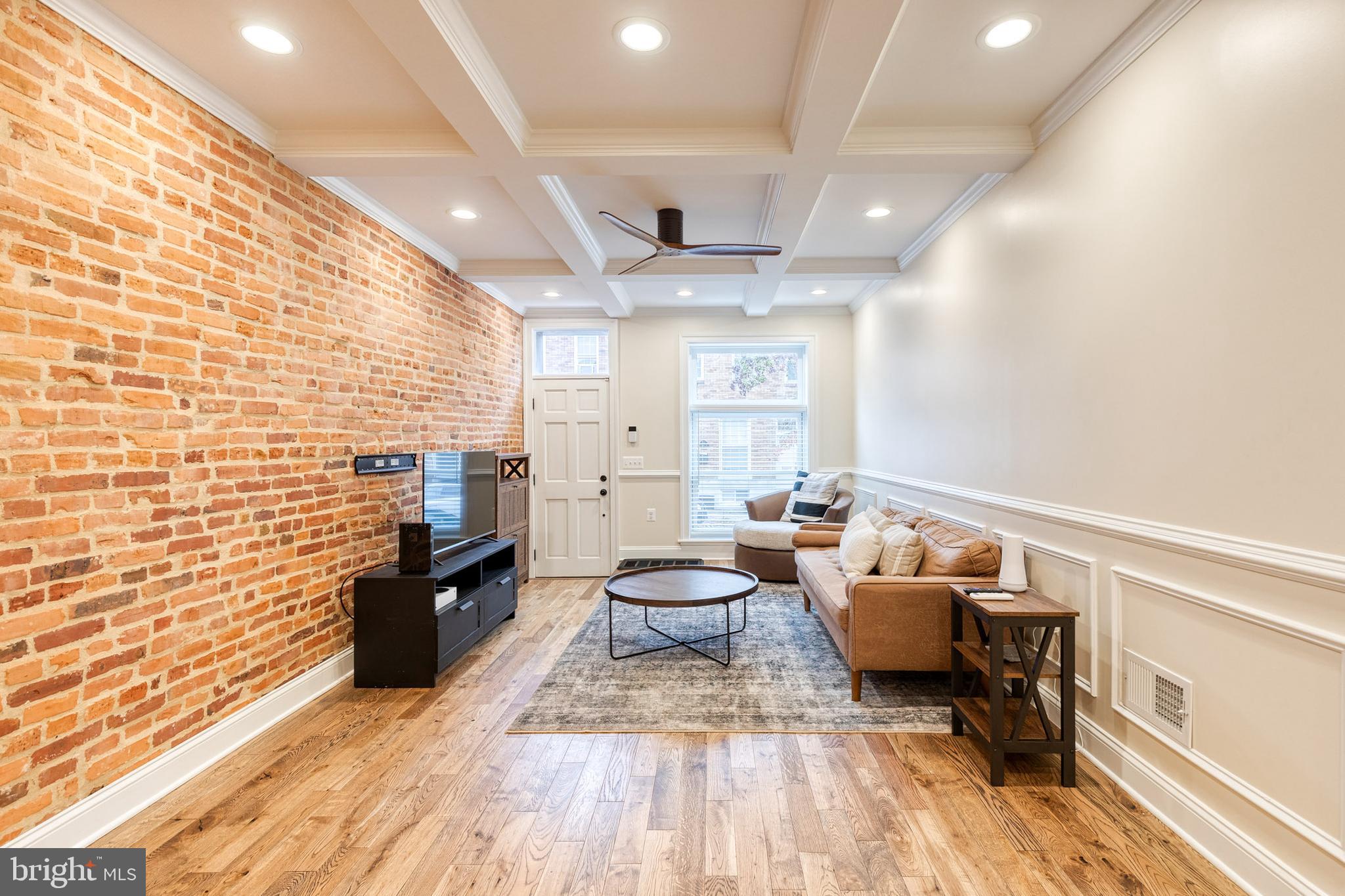 635 South Curley Street Baltimore, MD 21224 - Photo 6 of 20 a living room with furniture and a wooden floor