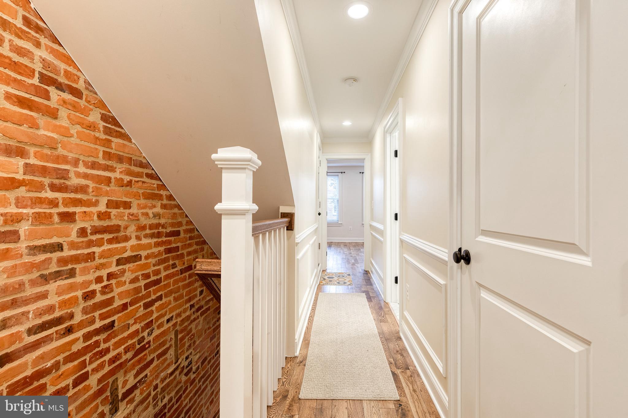 635 South Curley Street Baltimore, MD 21224 - Photo 8 of 20 a view of a hallway with a chandelier