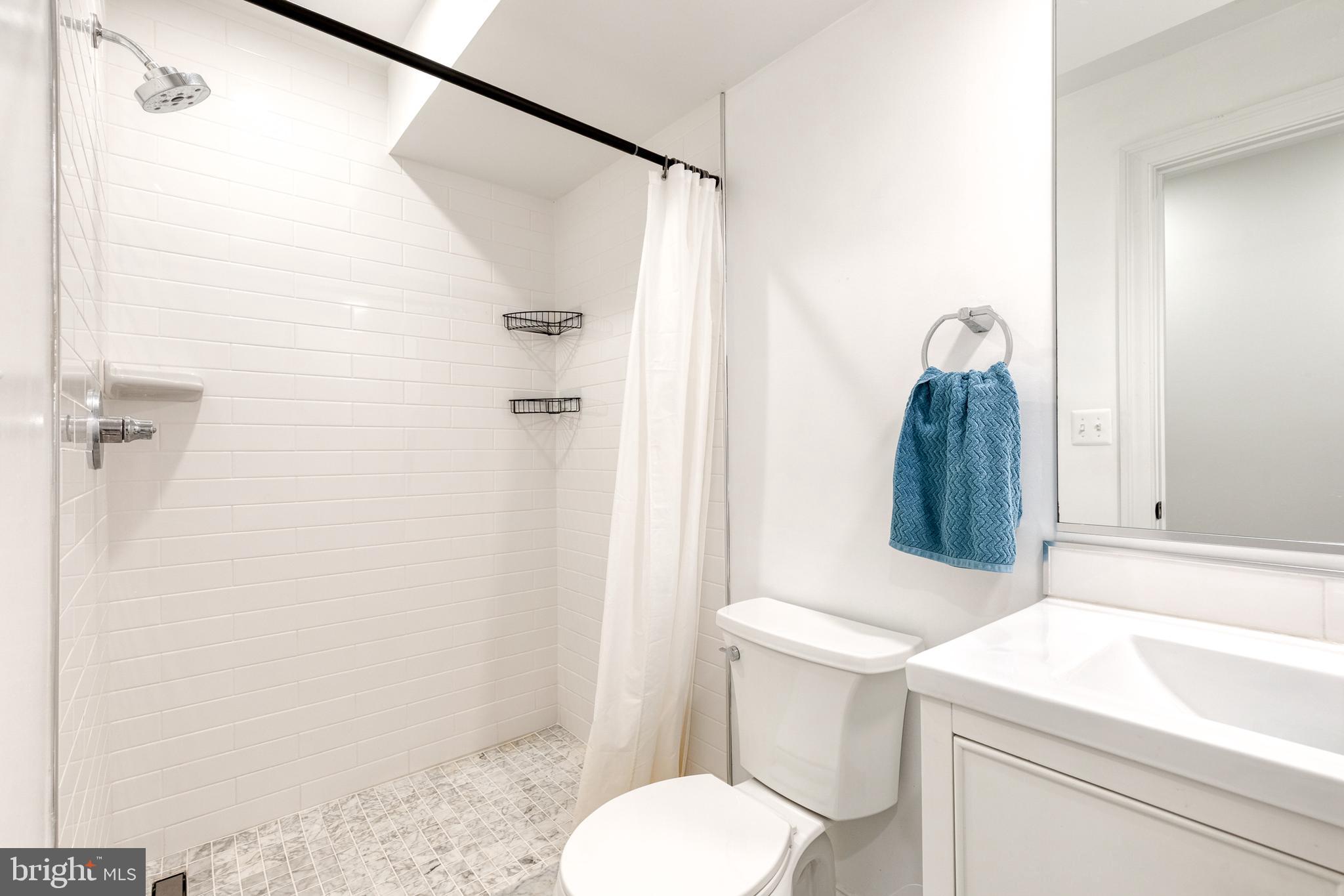 635 South Curley Street Baltimore, MD 21224 - Photo 10 of 20 a bathroom with a sink toilet and shower