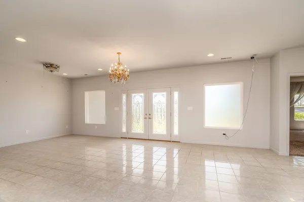 a view of an empty room with a window