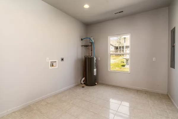 an empty room with a empty space and windows