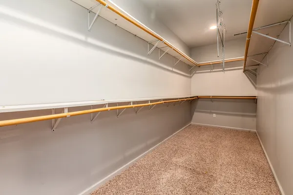 a spacious bathroom with a double vanity sink and a mirror