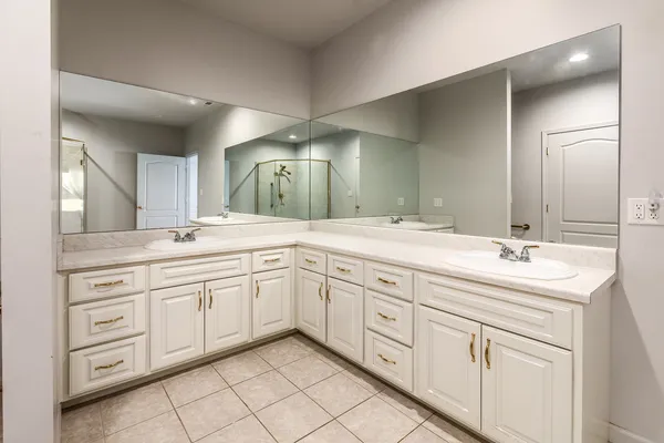 a bathroom with a shower and a mirror