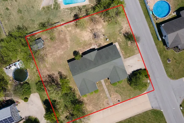 an aerial view of a house swimming pool